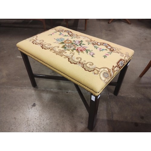 141 - A George III style mahogany stool, with floral tapestry seat