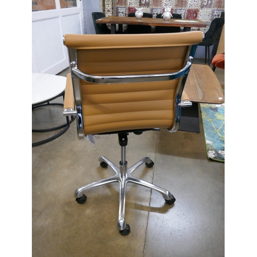 1323 - A tan Eames style office chair