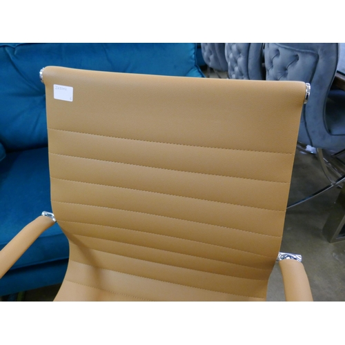 1324 - A tan Eames style office chair