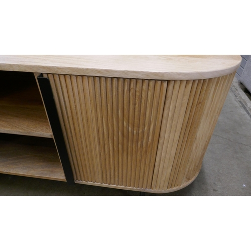 1438 - A light hardwood ribbed TV unit  *This lot is subject to VAT