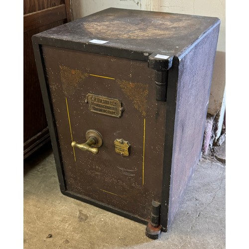 375 - A small Victorian cast iron safe, by C.H Wilson Birmingham, with keys