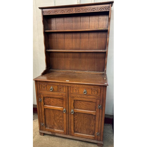 348 - A carved oak dresser