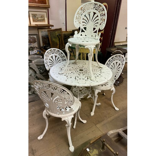 393 - A cast alloy white painted garden table and four chairs