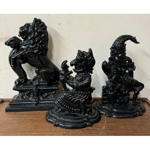 401 - A pair of Victorian cast iron Punch and Judy doorstops and one other