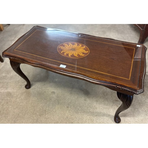 366 - An inlaid mahogany and glass topped coffee table