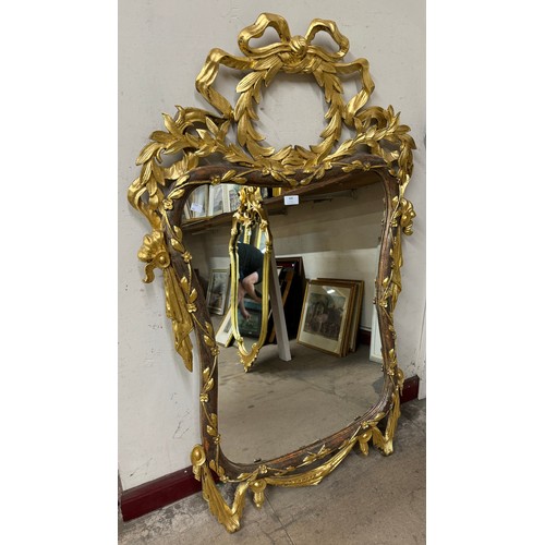 409 - A Regency style parcel gilt framed mirror