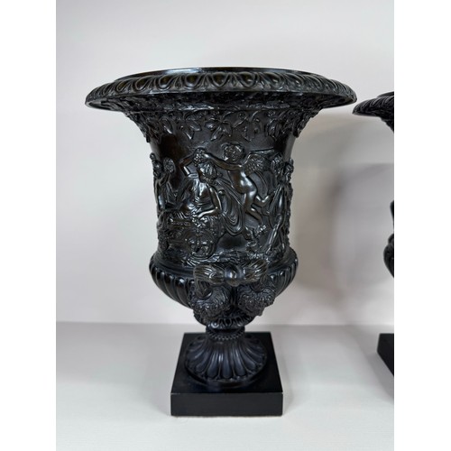 99 - A pair of 19th Century Italian Grand Tour bronze Medici vases, 27cms h