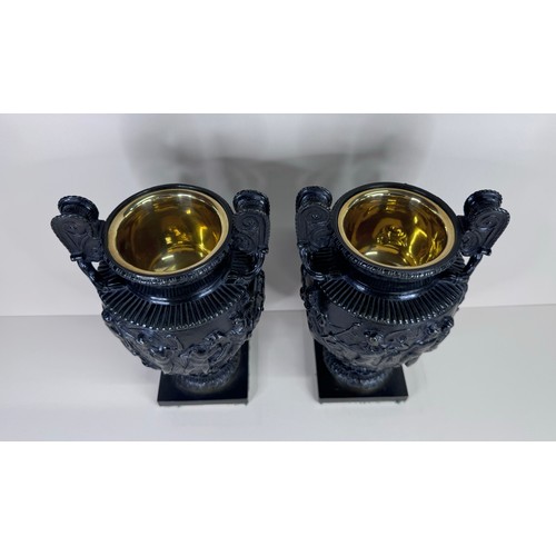 100 - A pair of 19th Century bronze Townley vases, 24cms h