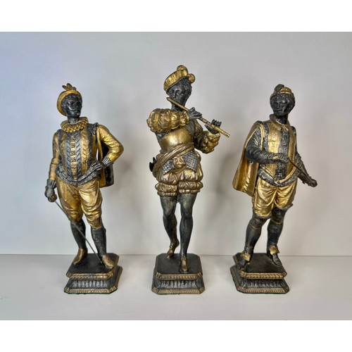 106 - A set of three 19th Century French gilt spelter figures of cavaliers and a musician, tallest; 25cms ... 