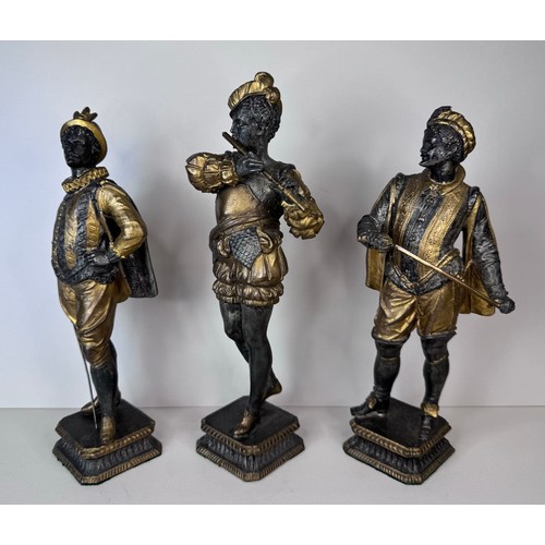 106 - A set of three 19th Century French gilt spelter figures of cavaliers and a musician, tallest; 25cms ... 