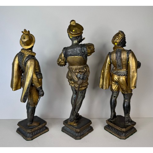 106 - A set of three 19th Century French gilt spelter figures of cavaliers and a musician, tallest; 25cms ... 