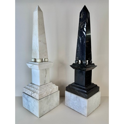 110 - A pair of 19th Century French white and black marble obelisks on stands, 49cms h