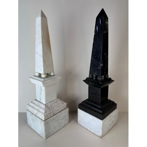 110 - A pair of 19th Century French white and black marble obelisks on stands, 49cms h