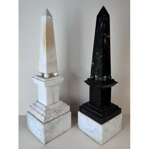 110 - A pair of 19th Century French white and black marble obelisks on stands, 49cms h