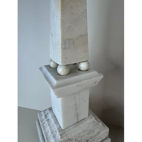 110 - A pair of 19th Century French white and black marble obelisks on stands, 49cms h