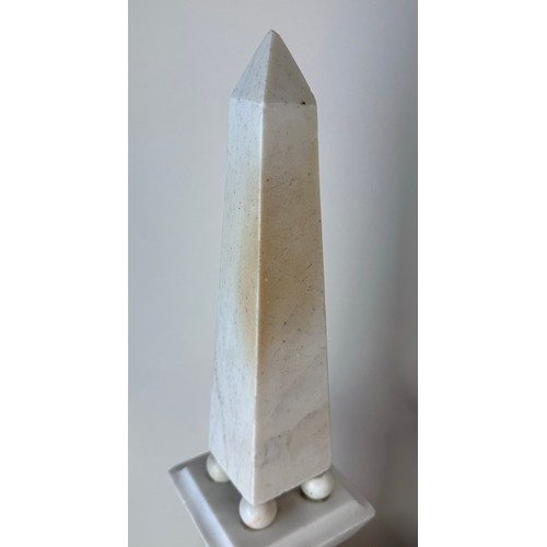 110 - A pair of 19th Century French white and black marble obelisks on stands, 49cms h