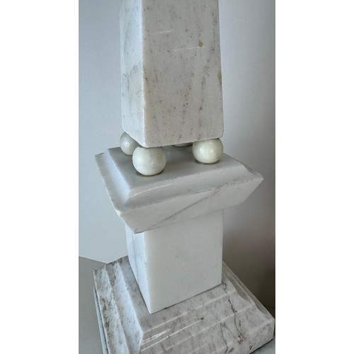 110 - A pair of 19th Century French white and black marble obelisks on stands, 49cms h