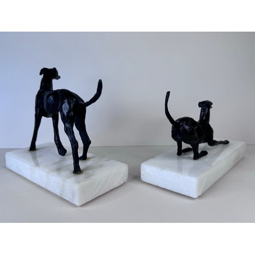 111 - A pair of early 20th Century French bronze greyhounds, on marble socles, tallest; 13cms h