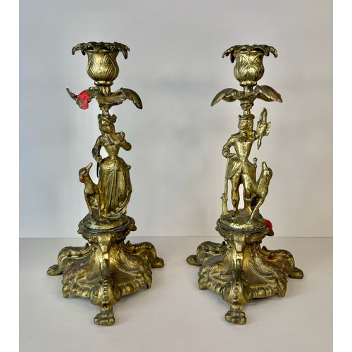 120 - A pair of 19th century figural brass candlesticks, 27cms h