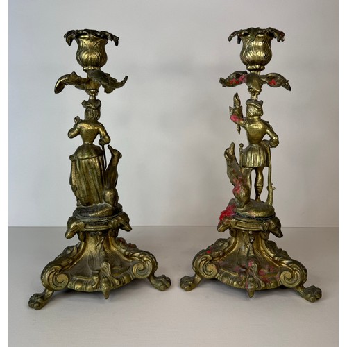 120 - A pair of 19th century figural brass candlesticks, 27cms h