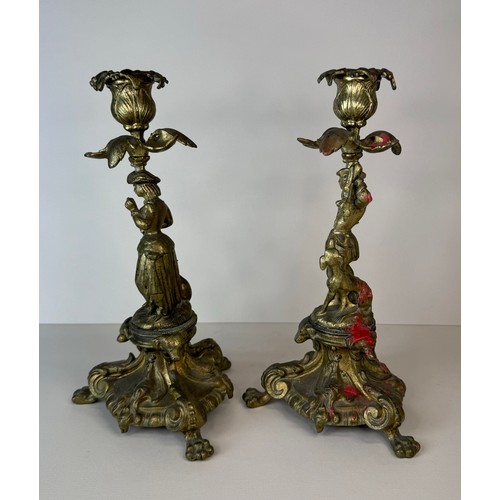 120 - A pair of 19th century figural brass candlesticks, 27cms h