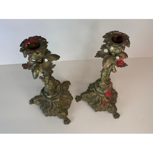 120 - A pair of 19th century figural brass candlesticks, 27cms h