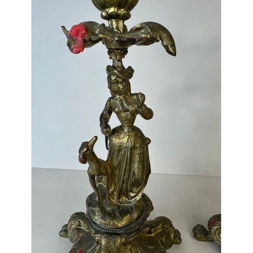 120 - A pair of 19th century figural brass candlesticks, 27cms h