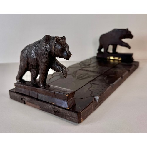 122 - An early 20th Century Black Forest carved wood bookslide