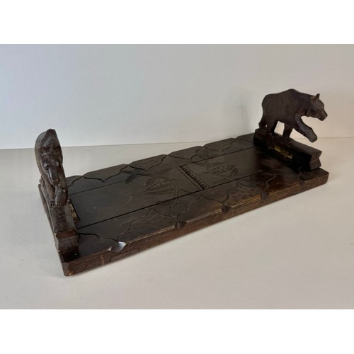 122 - An early 20th Century Black Forest carved wood bookslide