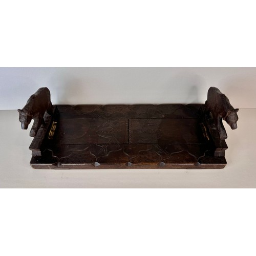 122 - An early 20th Century Black Forest carved wood bookslide