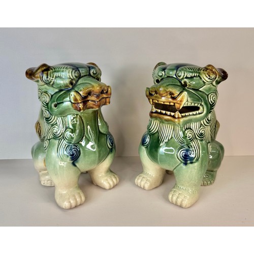 126 - A pair of Chinese green glazed porcelain Dogs of Foo