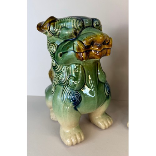 126 - A pair of Chinese green glazed porcelain Dogs of Foo