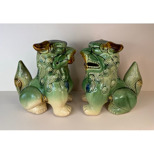 126 - A pair of Chinese green glazed porcelain Dogs of Foo