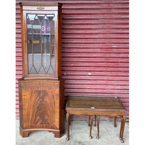 368 - A Regency style mahogany concave corner cabinet and a nest of tables