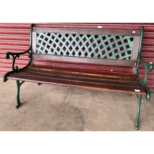 374 - A cast iron and painted pine garden bench