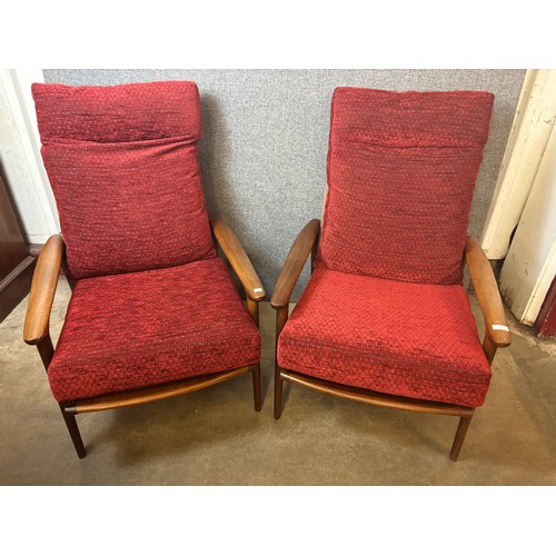 191 - A pair of Guy Rogers teak New Yorker armchairs. Please note this lot is being sold as a work of art.... 