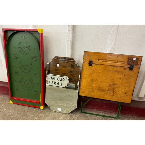 442 - A child's folding desk, a bagatelle board and a bevelled edge mirror