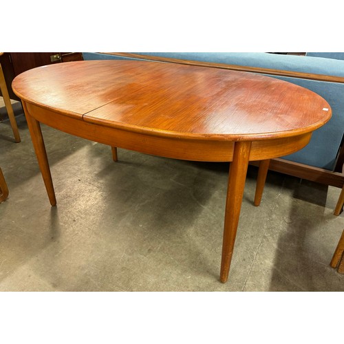 240 - A Jentique teak extending dining table