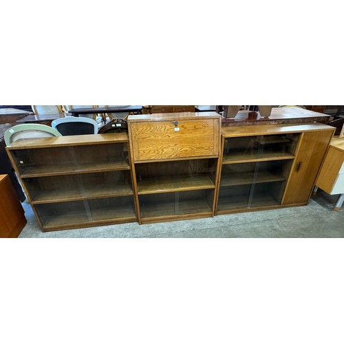 247 - Two oak bookcases and a bureau