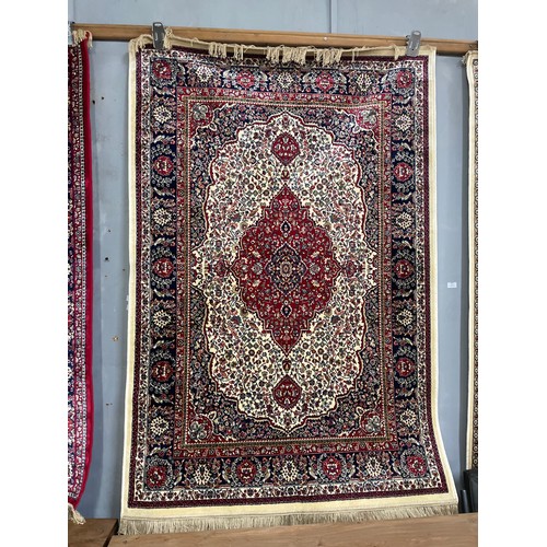 1421 - An ivory grand full pile cashmere rug, floral medallion design, 120 x 170cm