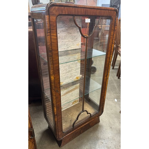 259 - An Art Deco walnut single door display cabinet