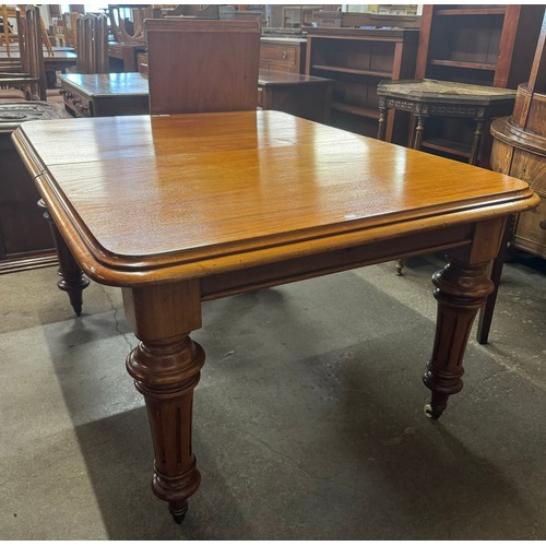 260 - A Victorian walnut extending dining table