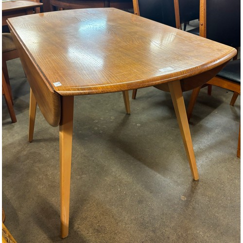 217 - An Ercol Blonde elm and beech Windsor drop leaf table