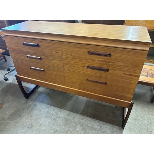 223 - A teak chest of drawers