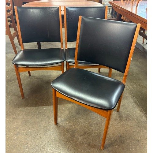 231 - A set of three Danish Erik Buch teak and black vinyl dining chairs