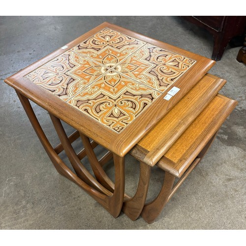 235 - A G-Plan Astro teak and tiled topped nest of tables