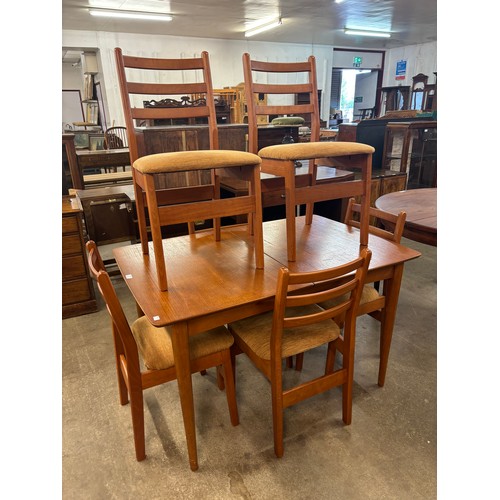 237 - A teak extending dining table and six chairs