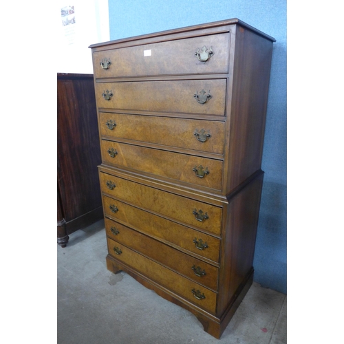 150 - A George III style walnut and burr walnut chest on chest