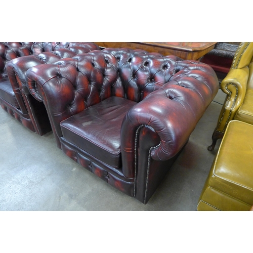 153 - An oxblood red leather Chesterfield club chair