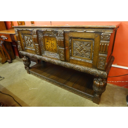 158 - An Elizabethan Revival carved oak dresser